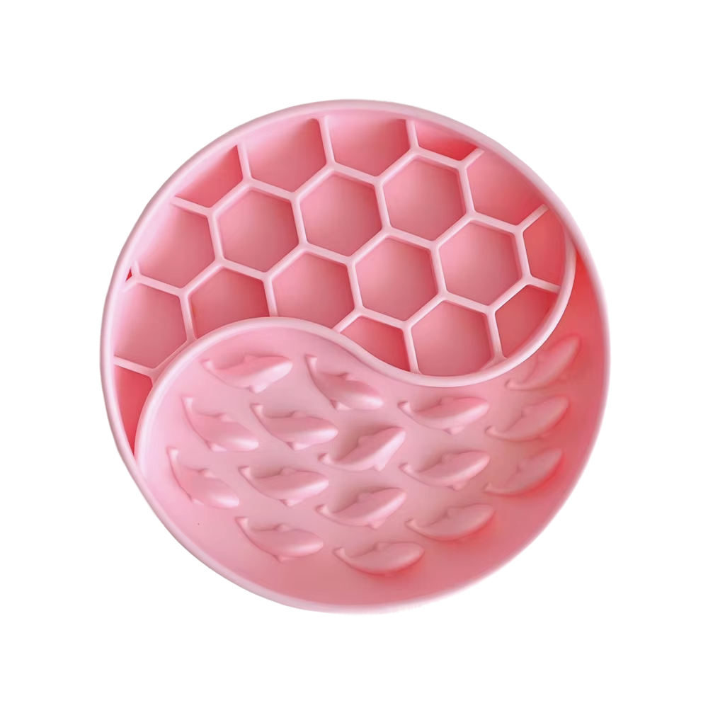 Pink silicone mold with honeycomb and leaf patterns on a white background