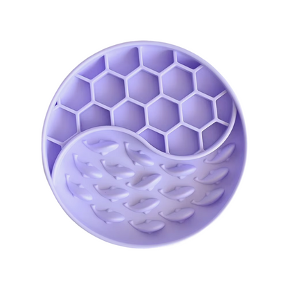 Lilac silicone mold with honeycomb and leaf patterns on a white background