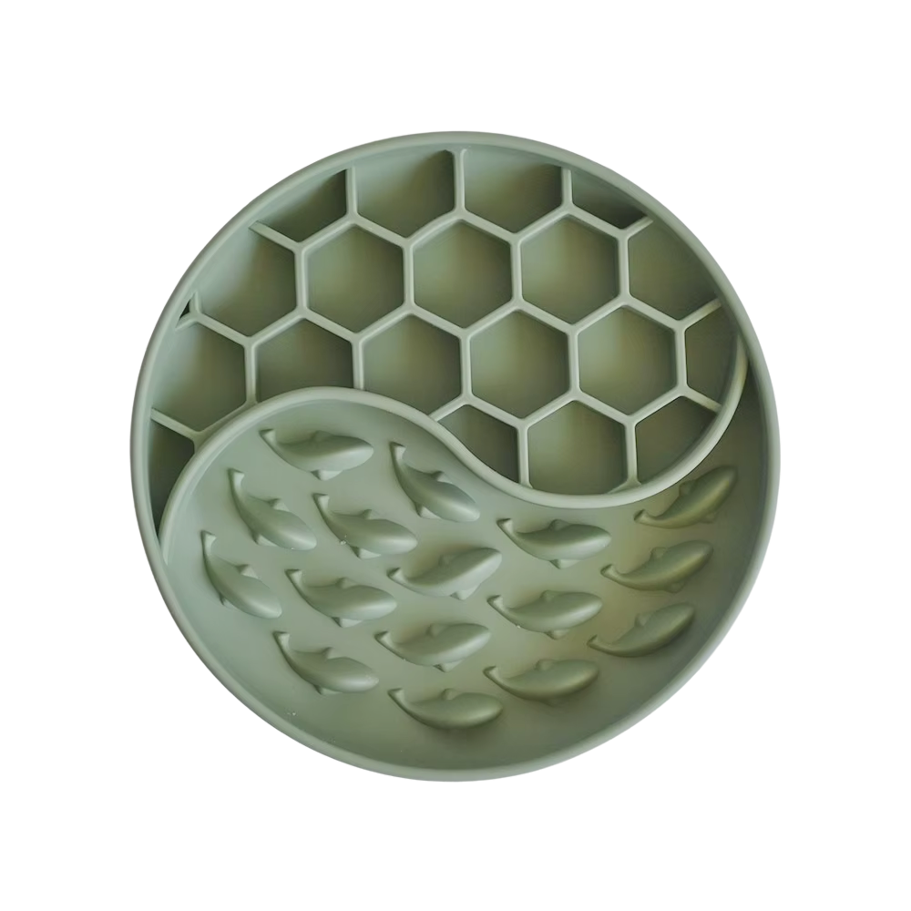 Green silicone mold with honeycomb and leaf patterns on a white background