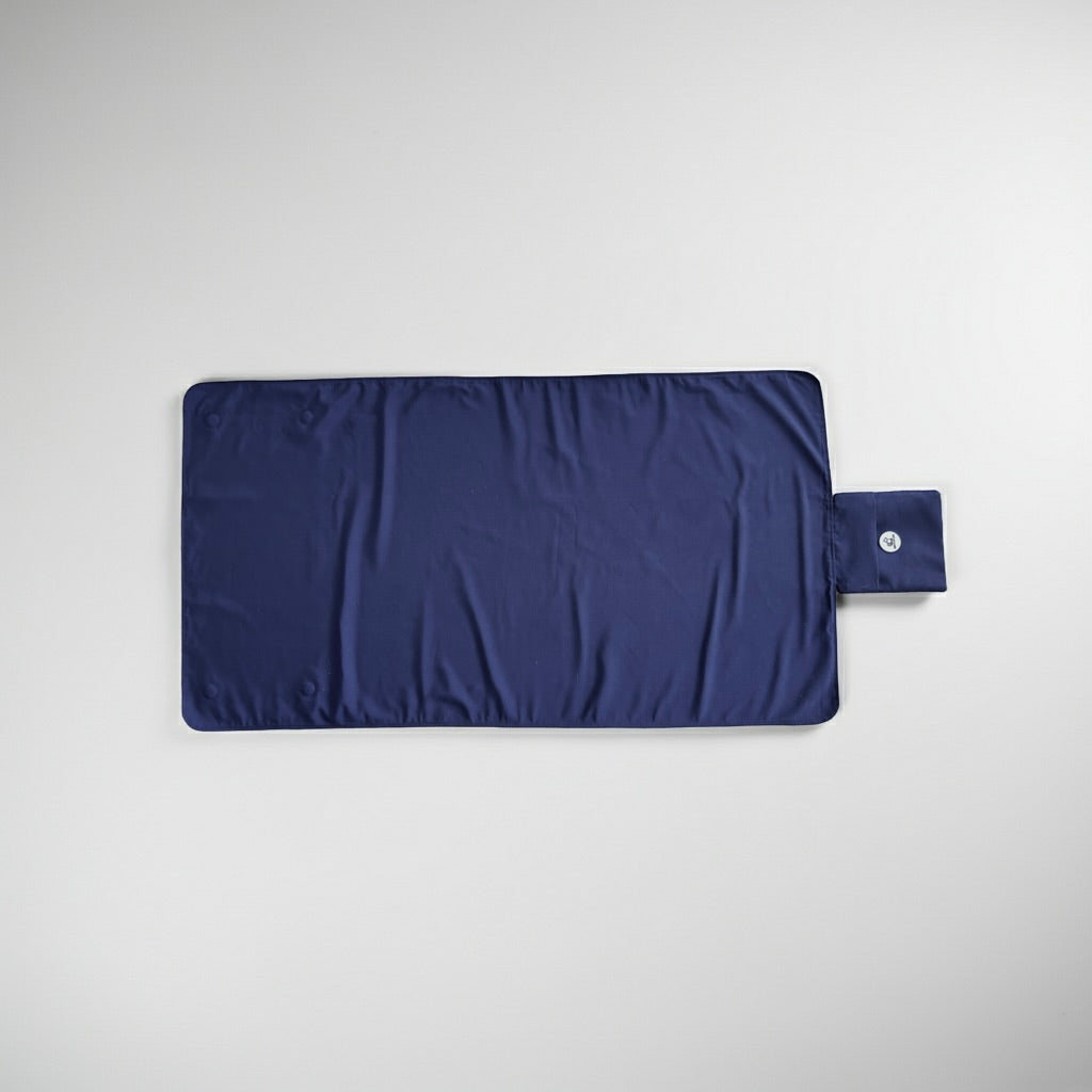 Navy blue dog training mat on a light gray background